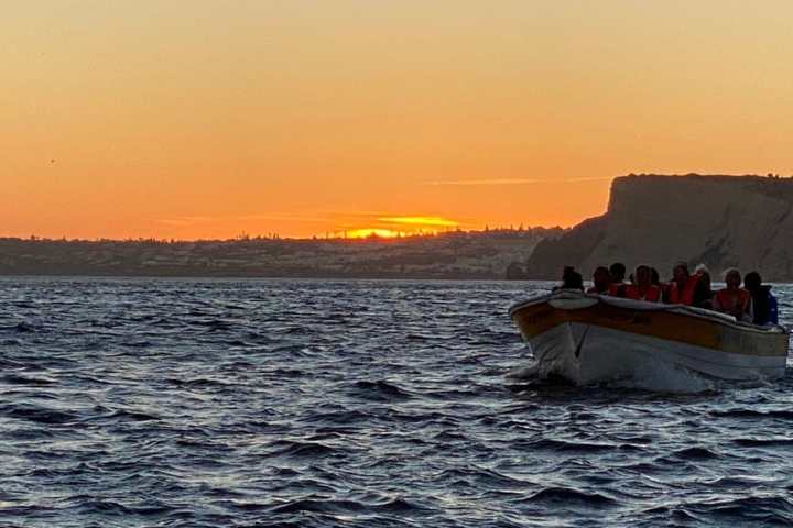 a sunset over a body of water